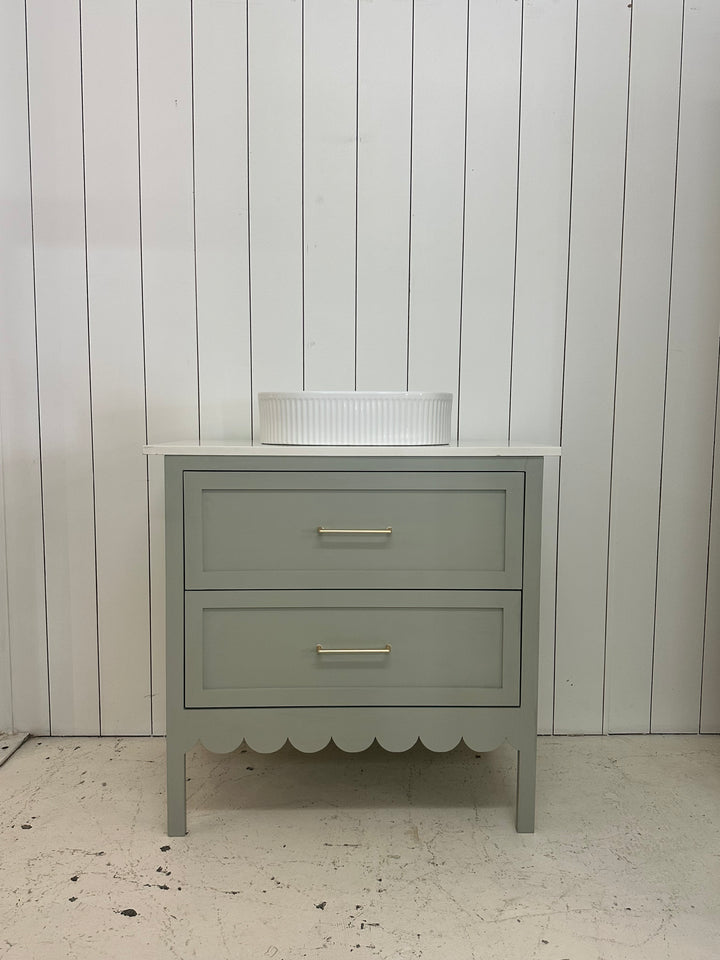 Gray wall-mounted cabinet against a light gray wall