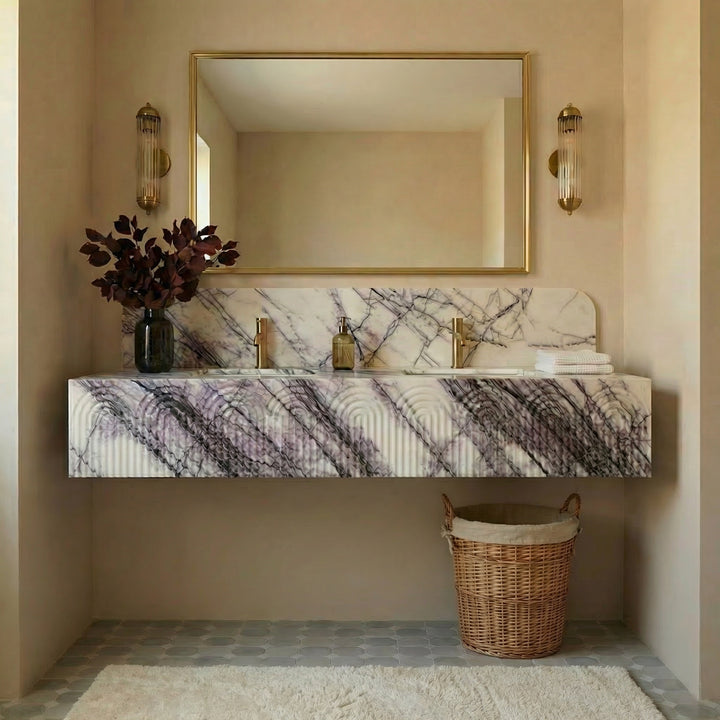 Marble-patterned vanity with a mirror, lights, and a basket in a bathroom setting.