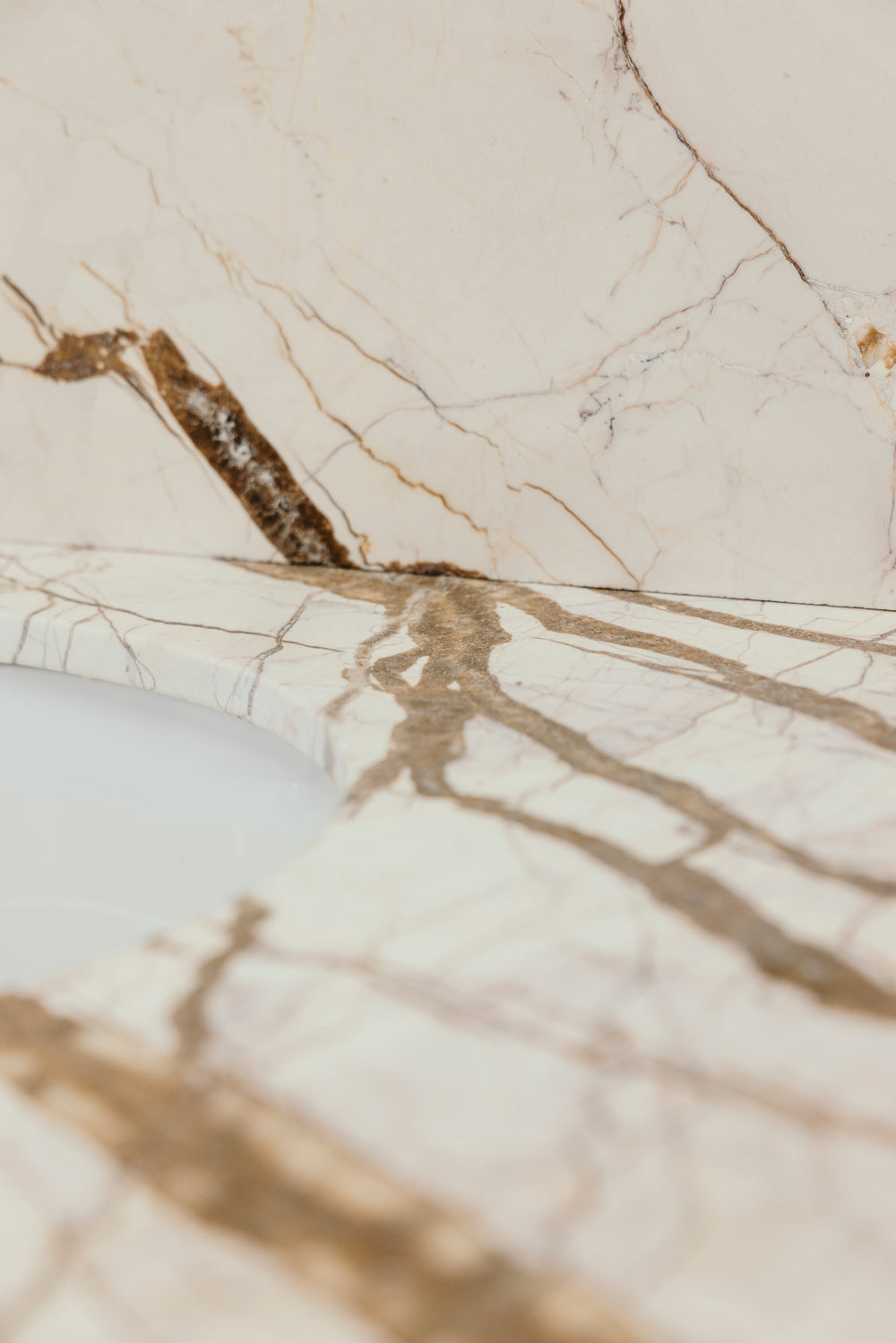 Close-up of a marble surface with beige and brown veins