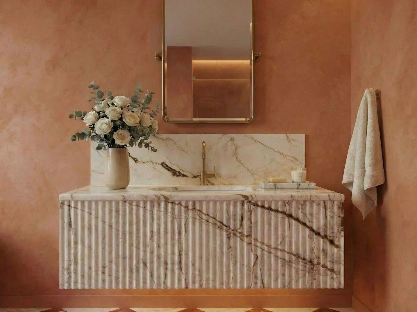 A marble bathroom vanity in a terracotta bathroom