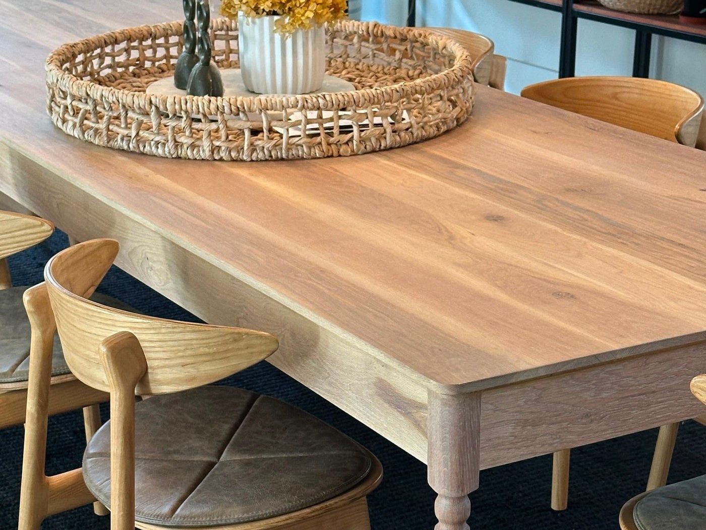 An oak dining table with chairs